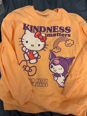 Hello Kitty Peach Crewneck Sweatshirt with Purple Graphic